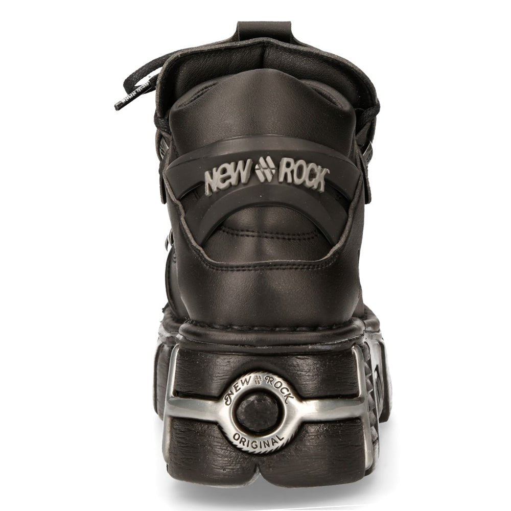 Trasera del botín M-106-VS1 con logotipo New Rock y medallón metálico en el talón