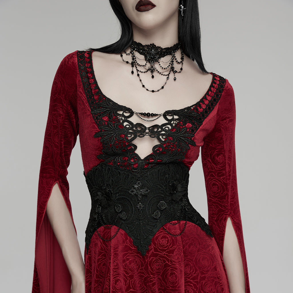 Corsé de cintura gótico negro de encaje puesto sobre un vestido rojo, vista frontal