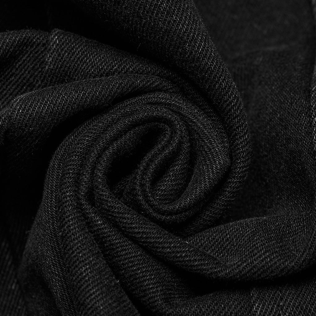 Detalle del tejido de sarga negra del chaleco