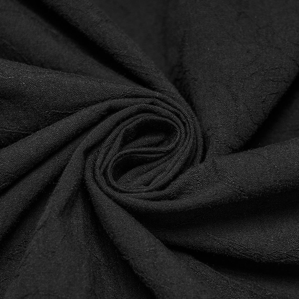 Jacquard de algodón negro con dibujo tono sobre tono visto de cerca
